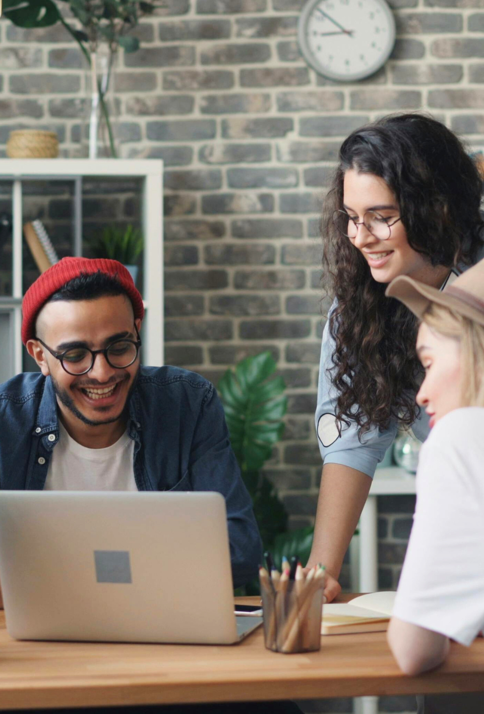 group-of-people-looking-at-the-laptop