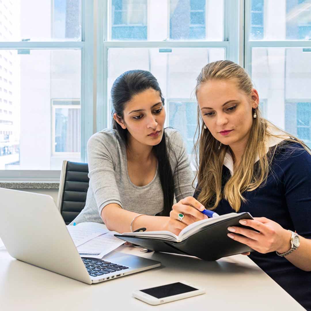 Adelaide Campus students reading textbook